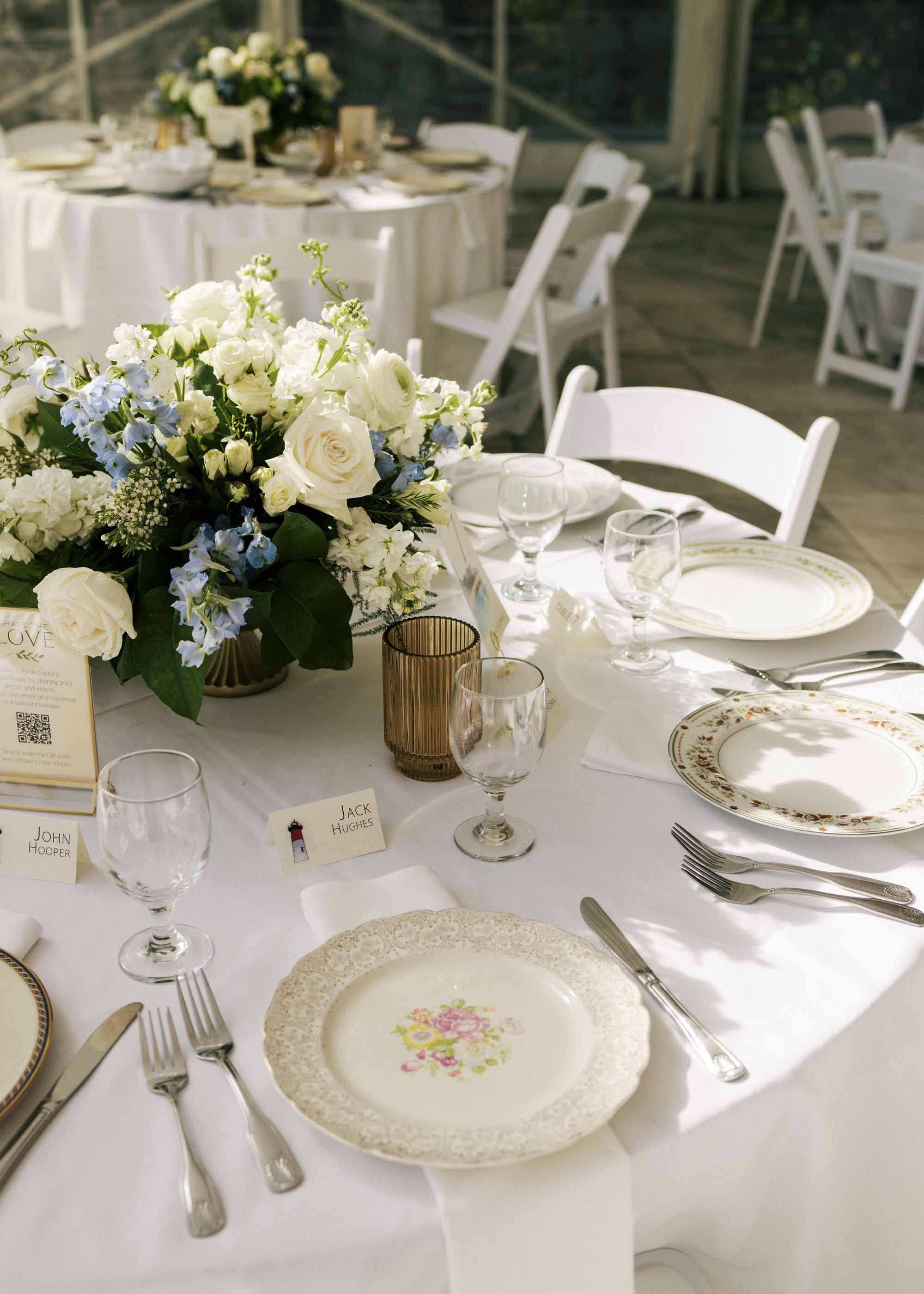 Wedding reception table with thrifted vintage plates