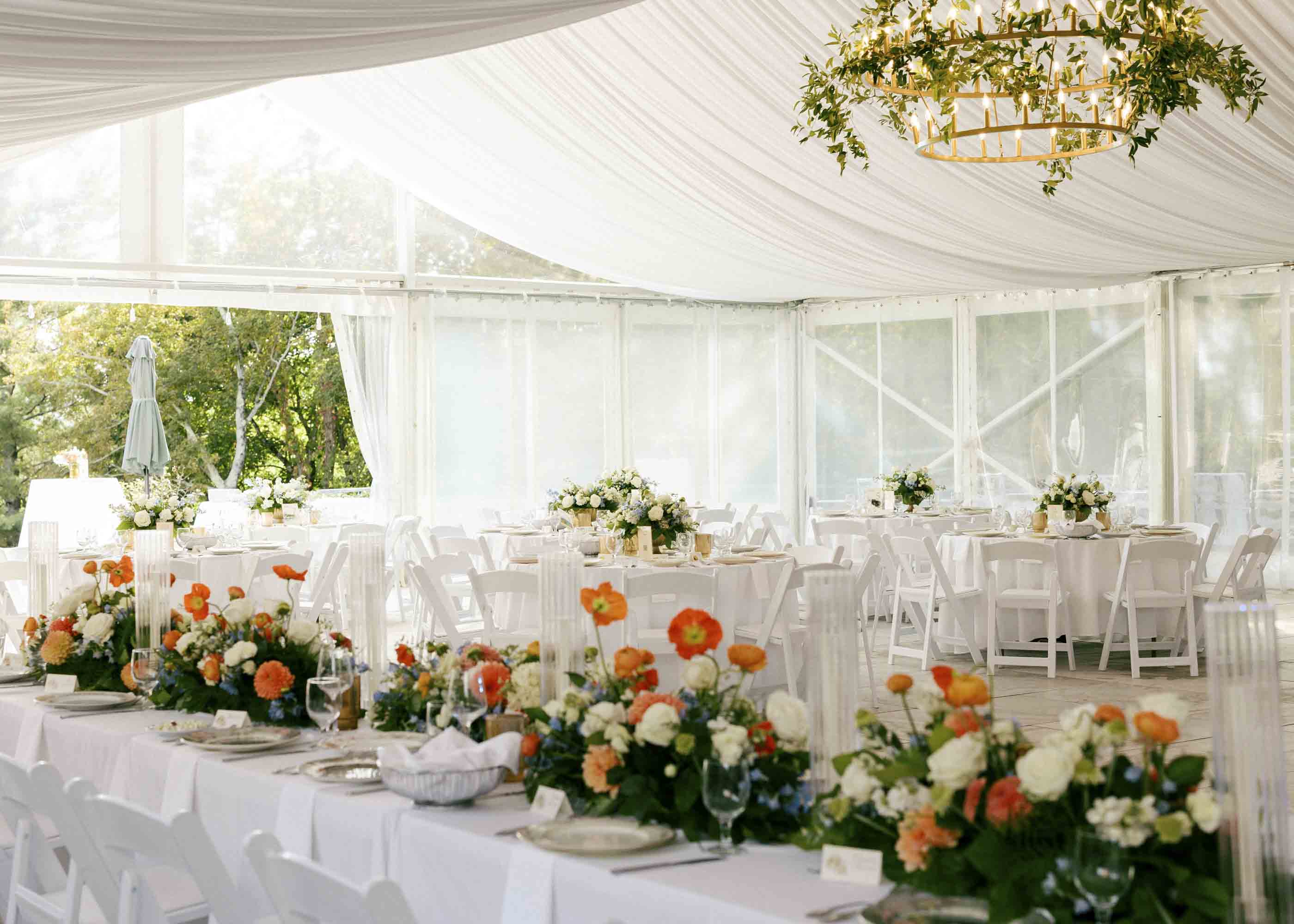Modern tent wedding reception with ceiling drapery