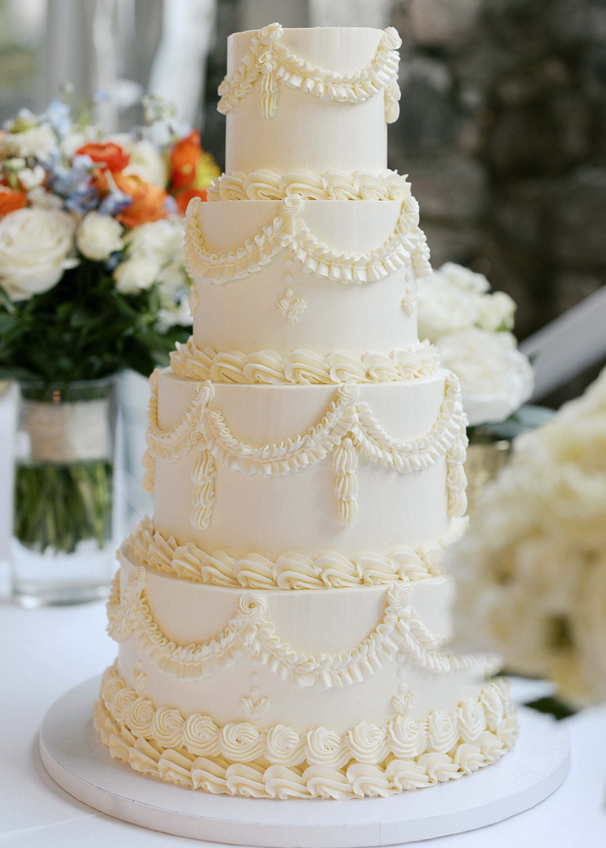All white vintage Lambeth piping wedding cake with 4 tiers