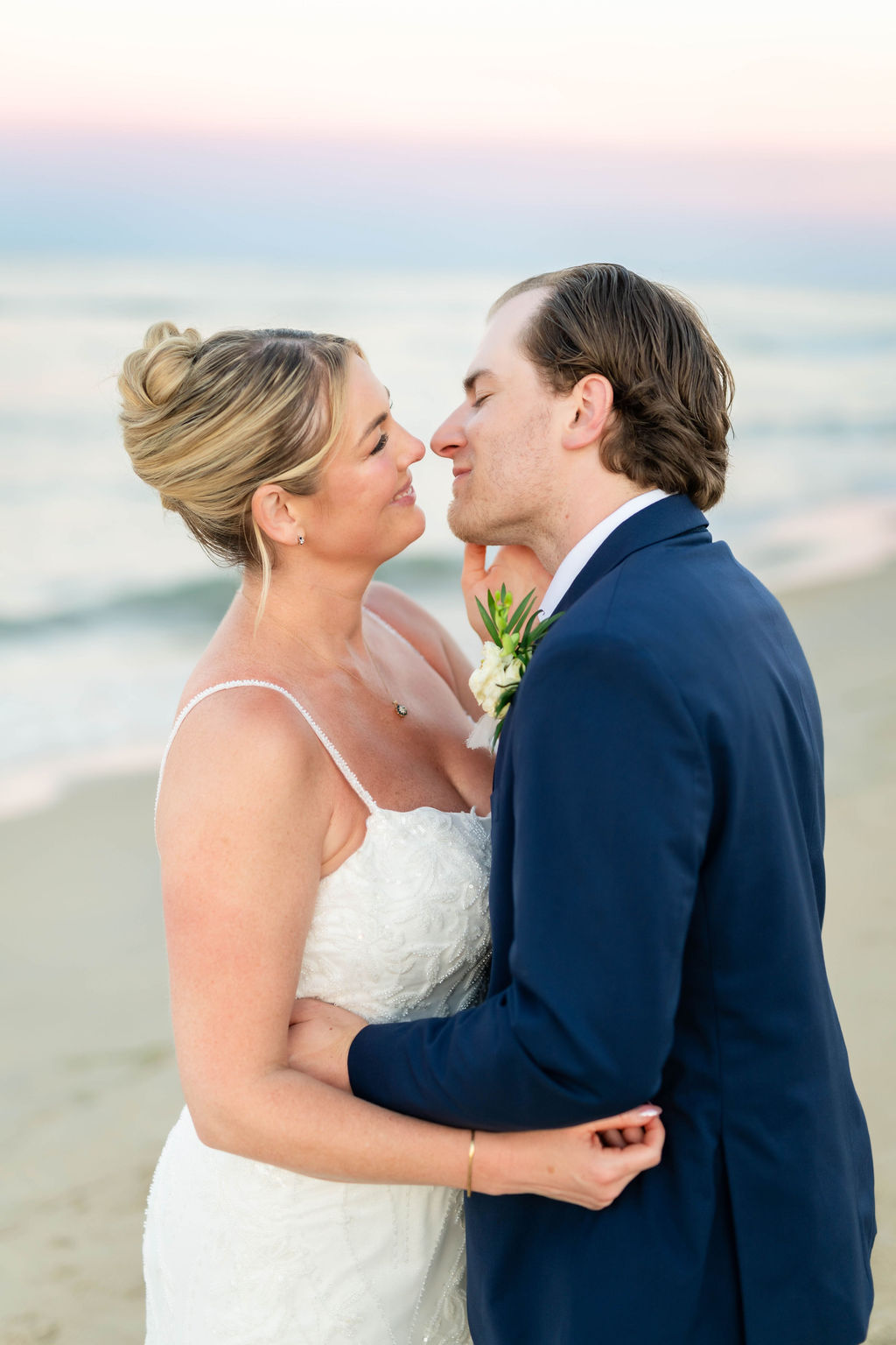 Bride and groom on the beach in Virginia Beach for wedding photos