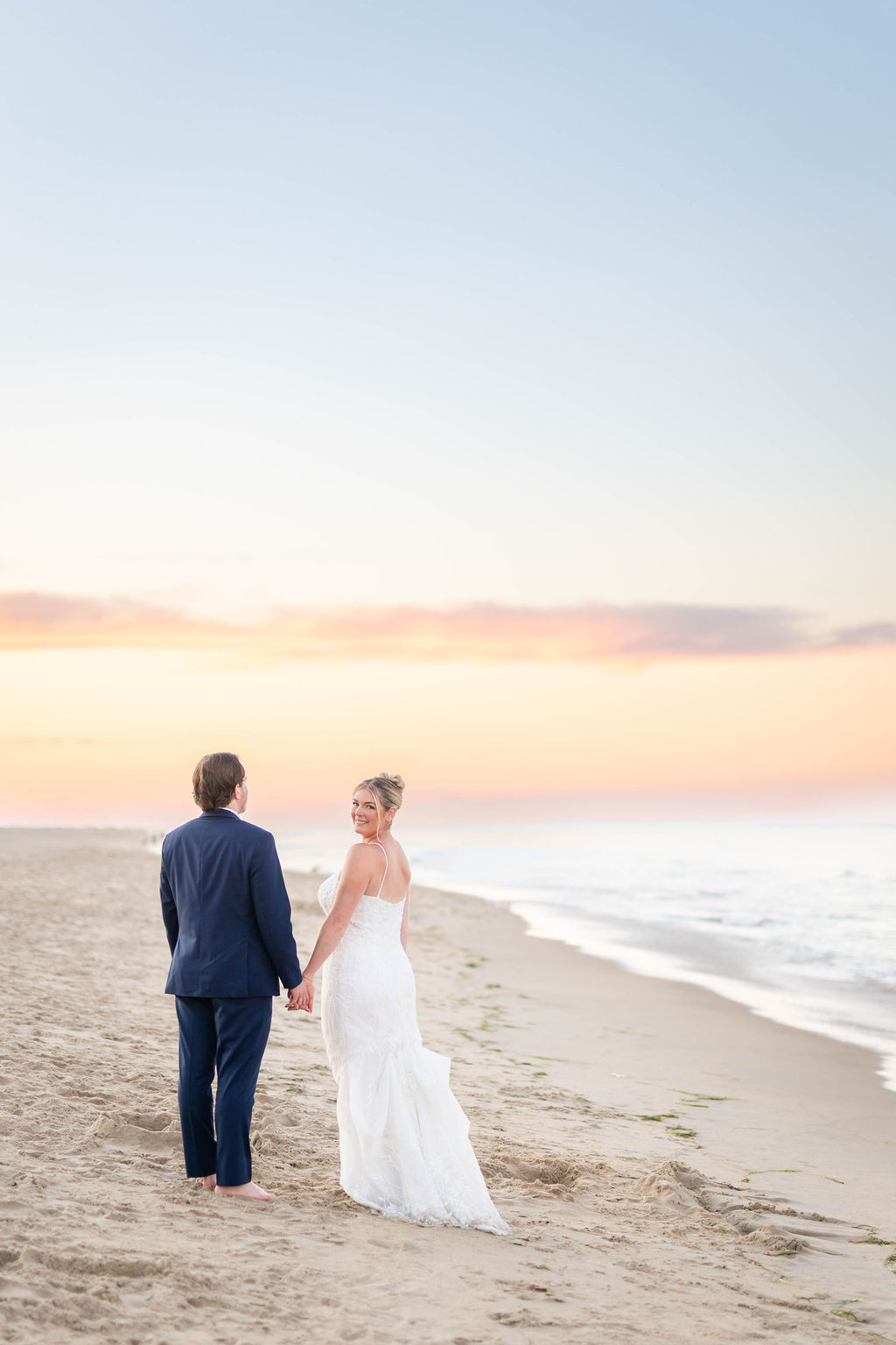 Bride and groom on the beach in Virginia Beach for wedding photos