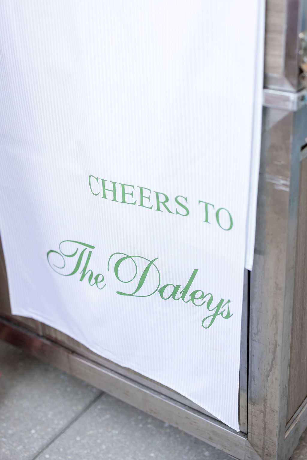 Personalized striped fabric wedding bar sign with green Cheers message made with a Cricut