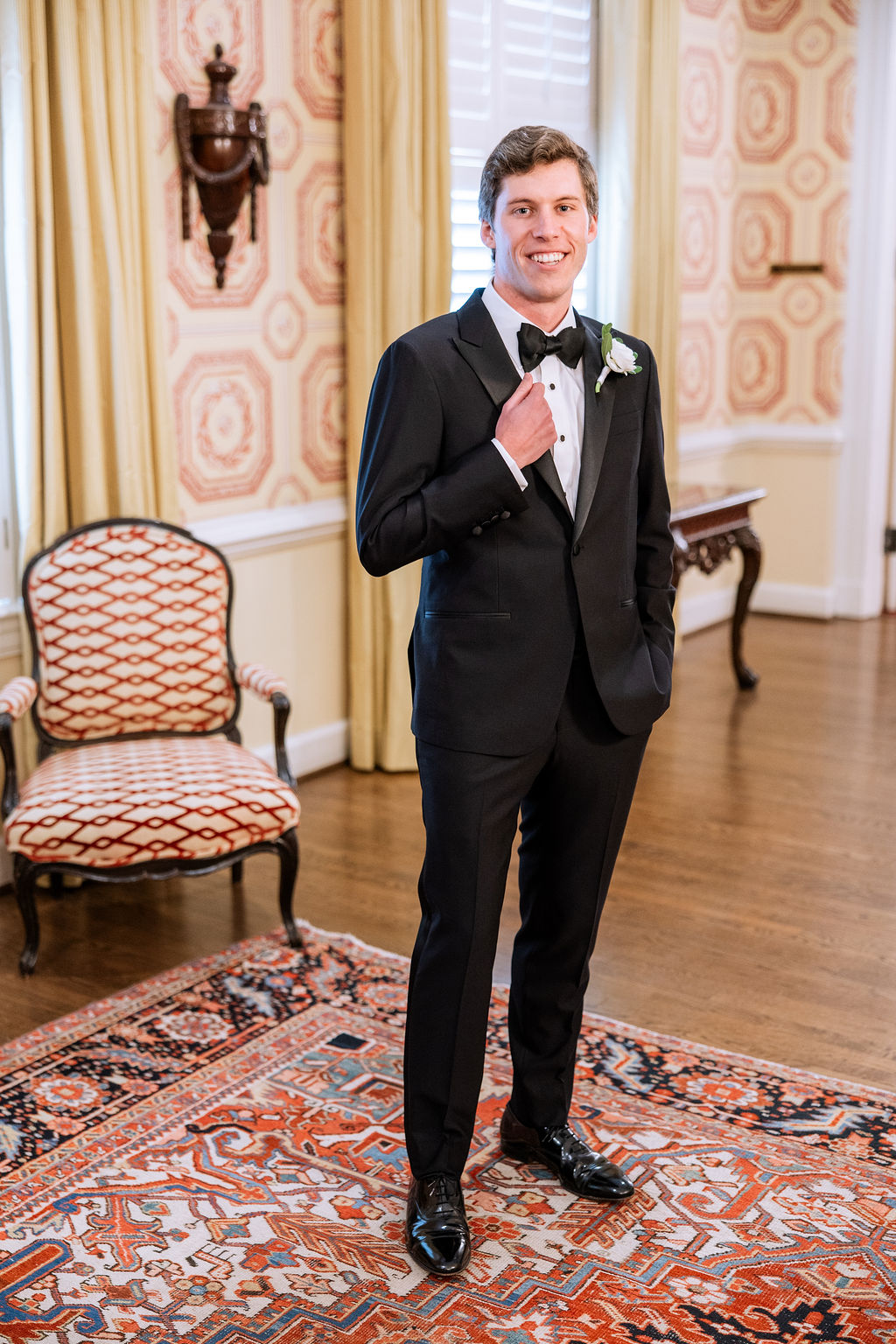 Groom wearing classic black tuxedo for country club wedding