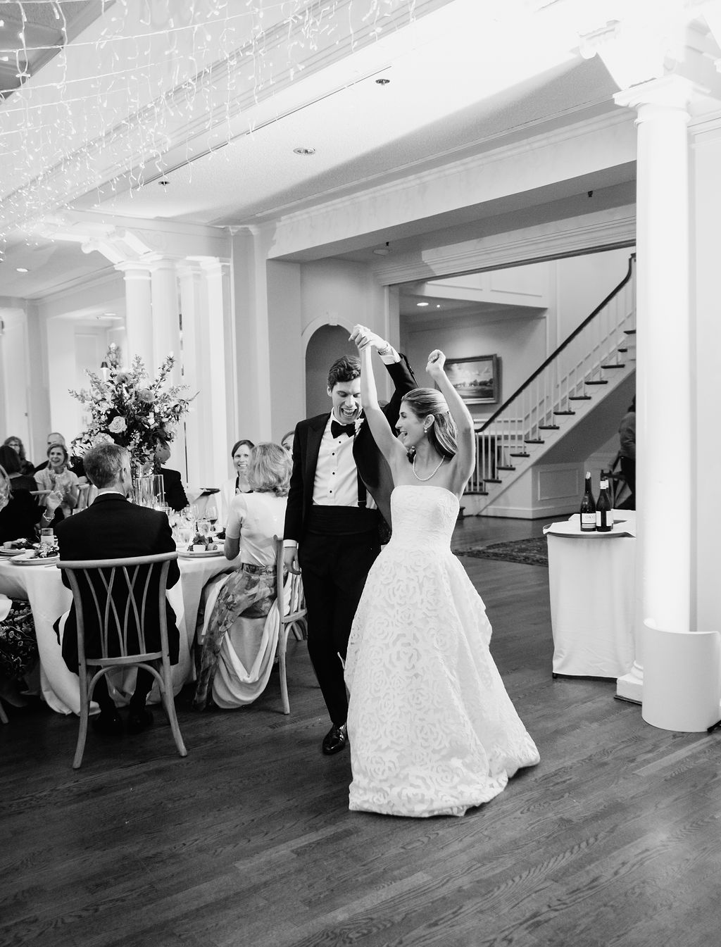 Bride and groom entering their wedding reception at Country Club of Virginia