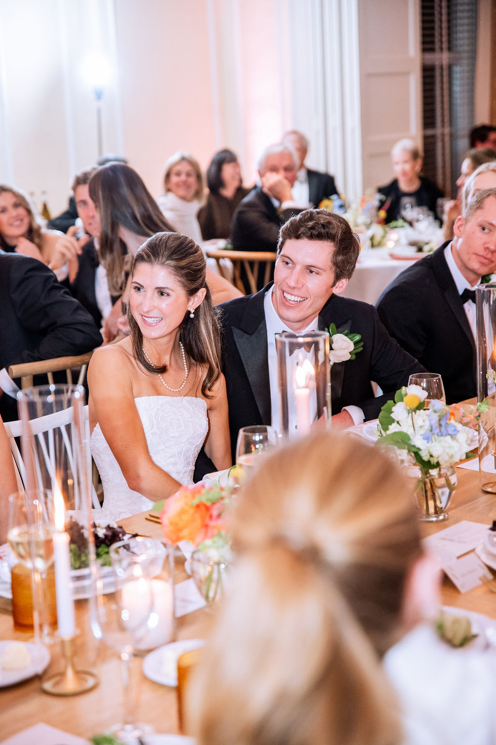 Bride and groom at kings table for their country club wedding