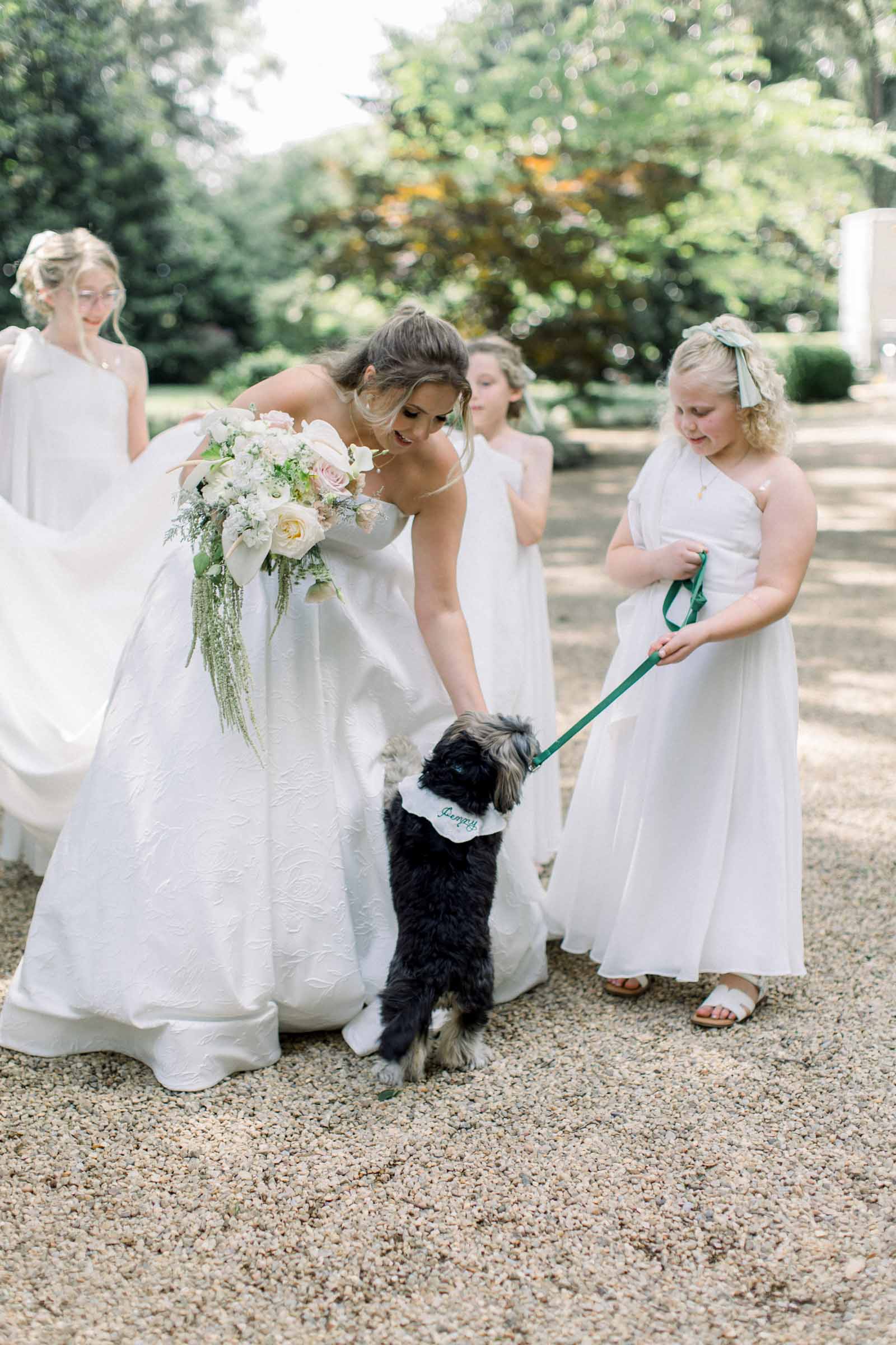 Bride loving her dog Penny on the wedding day
