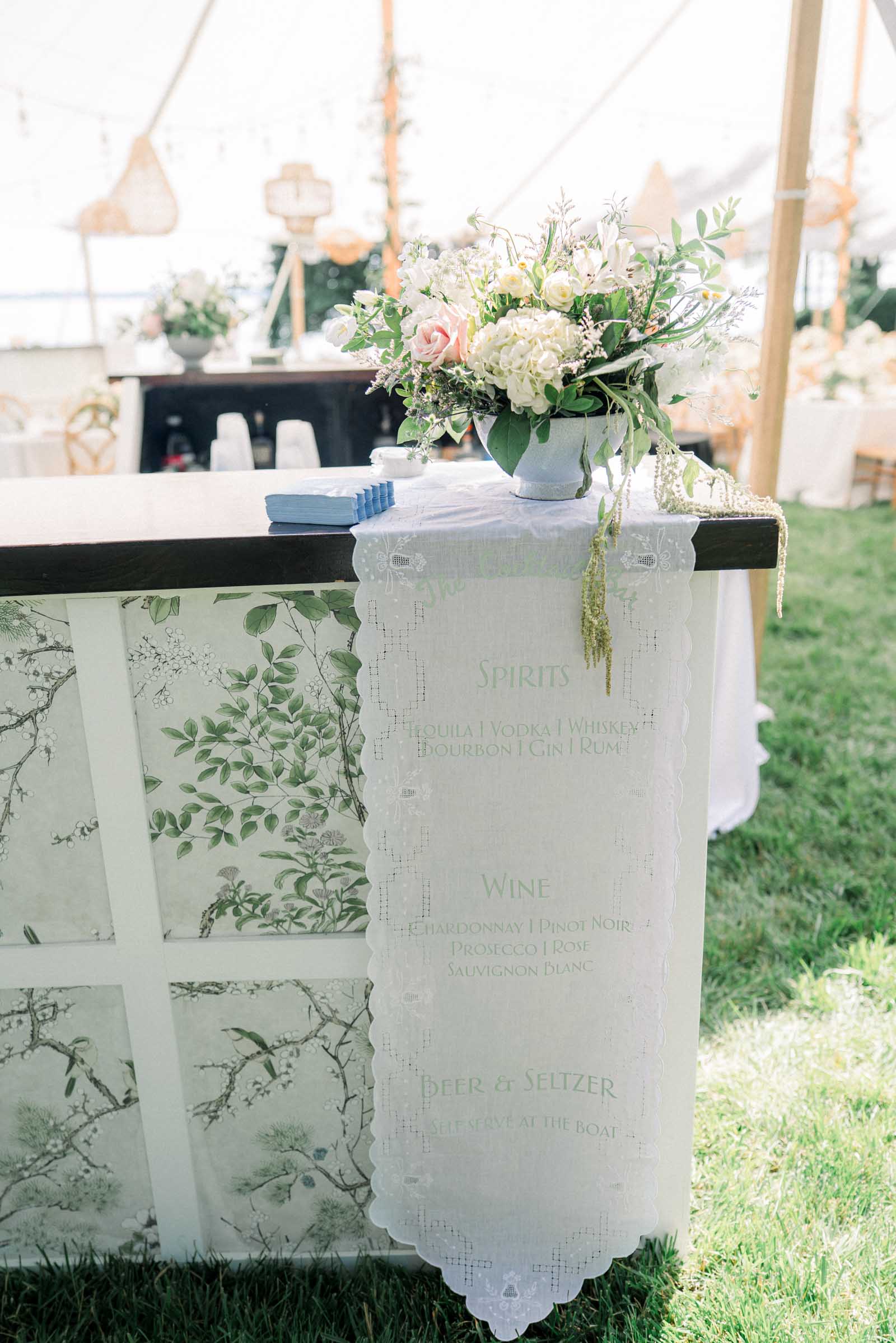Cricut made wedding fabric bar sign with a vintage table runner and sage green heat transfer vinyl