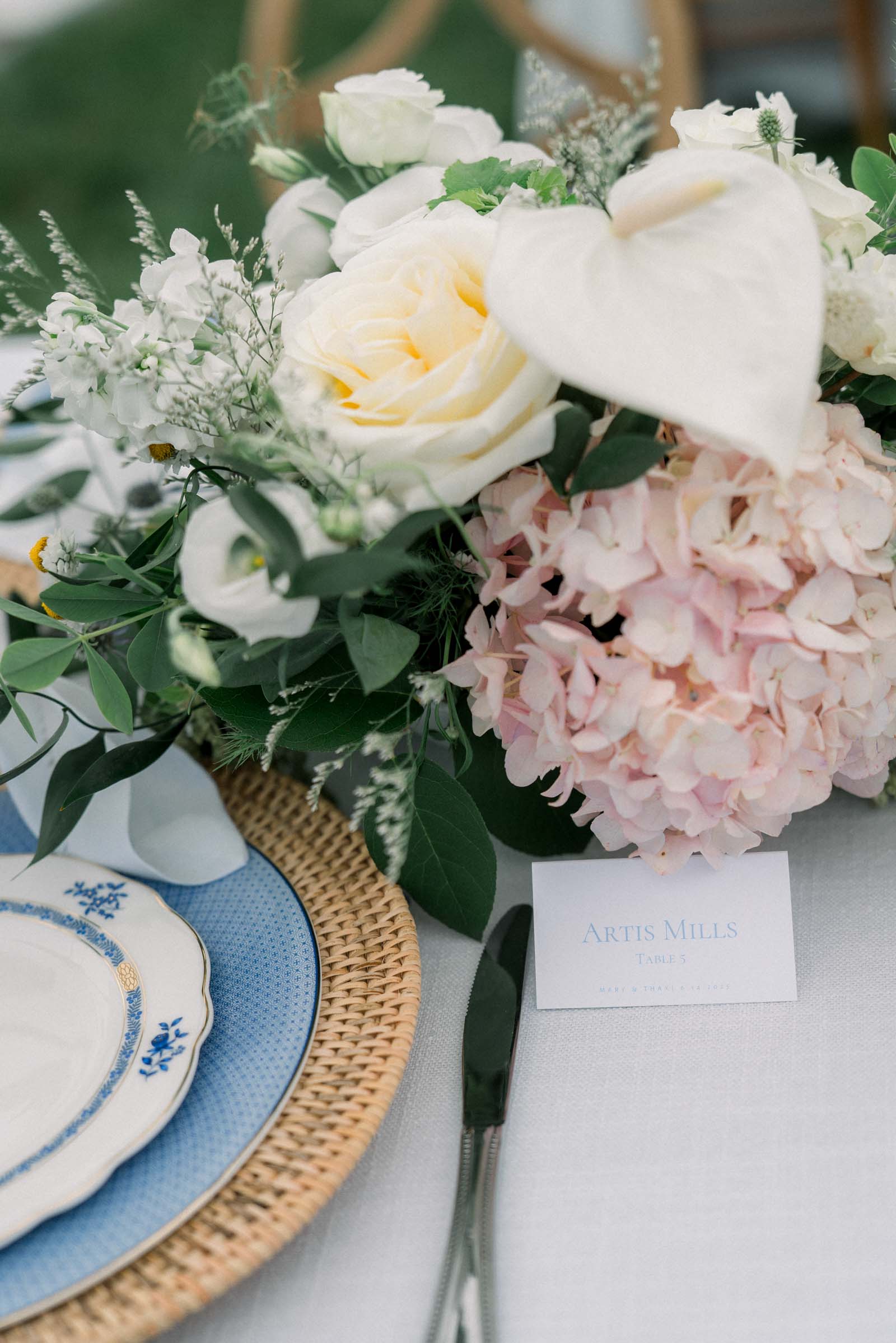 Pale blue and white tented wedding escort card