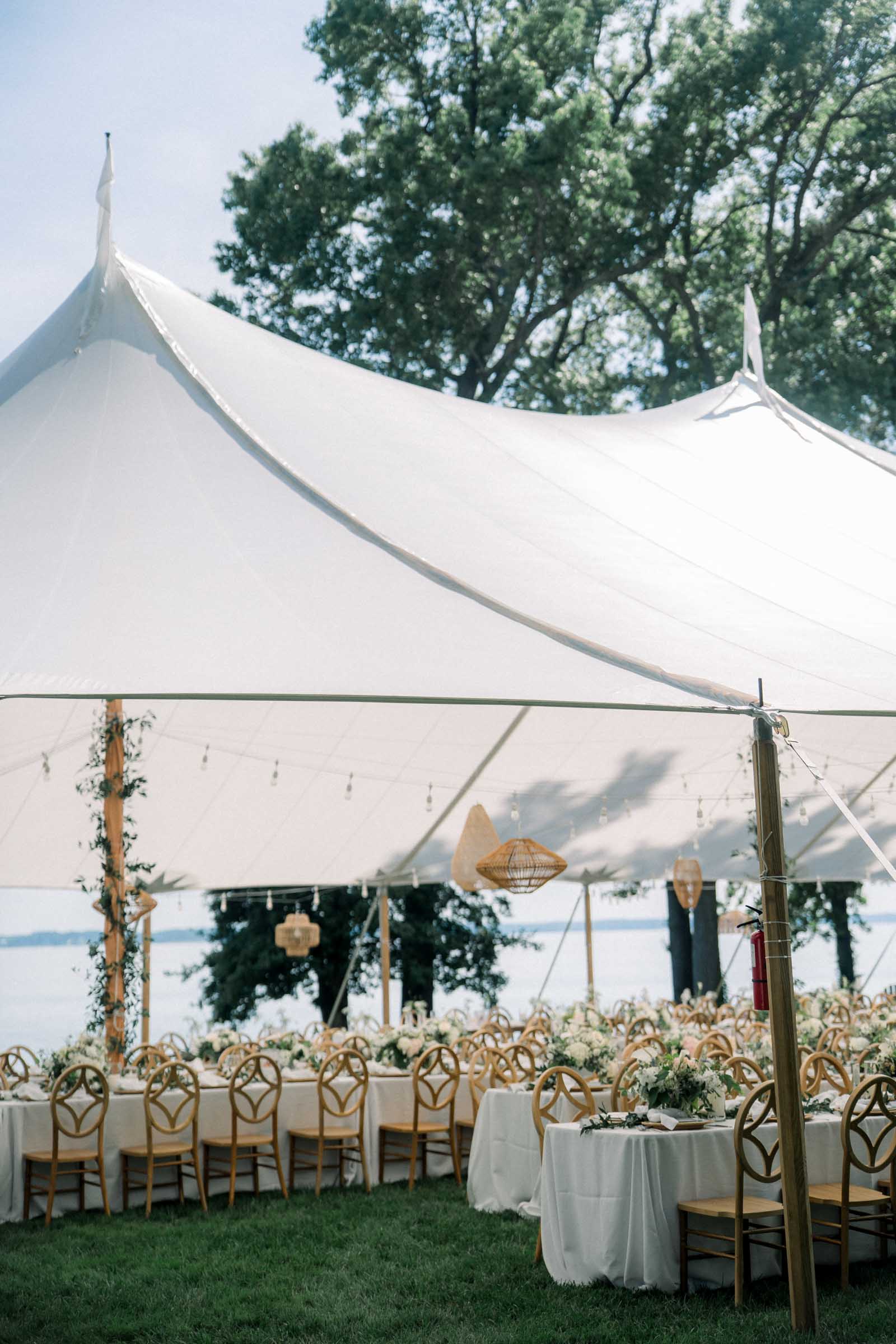 Tented reception overlooking the Rappahannock River for outdoor wedding day